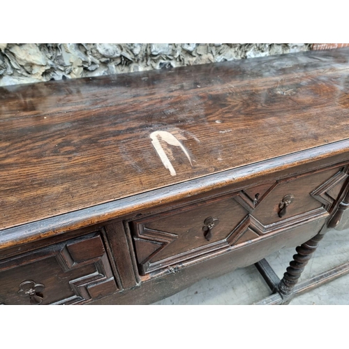 1065 - A large antique oak dresser base, 240.5cm wide.