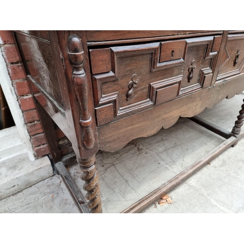 1065 - A large antique oak dresser base, 240.5cm wide.