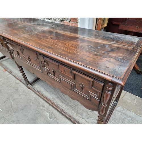 1065 - A large antique oak dresser base, 240.5cm wide.