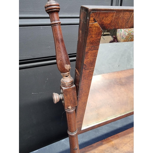 1066 - An early 19th century mahogany toilet mirror, 61.5cm wide. 