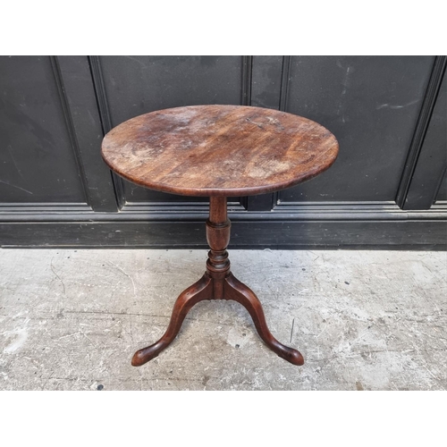 1068 - A George III mahogany circular tripod table, 52.5cm diameter, (reduced in height). ... 