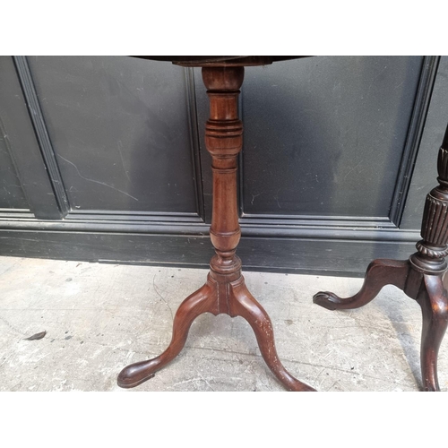 1071 - Two 19th century mahogany circular tilt top tripod tables, each with dished top, 66.5cm and 56cm dia... 