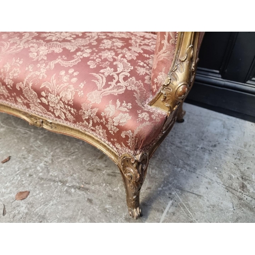 1078 - A Louis XV style carved giltwood settee, 156cm wide.