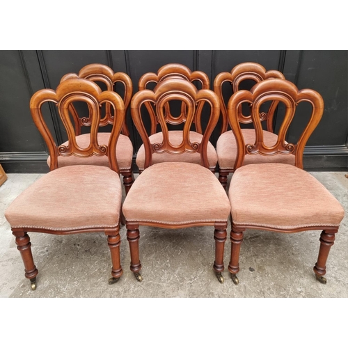 1083 - A set of six Victorian mahogany dining chairs. (6)