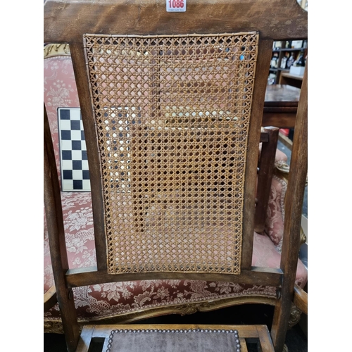 1086 - A late 19th century beech and cane 'Patent Automatic Adjusting' steamer type chair.