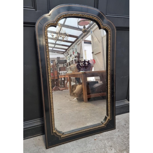 1096 - A large ebonzied and gilt brass framed mirror, 137 x 83cm.