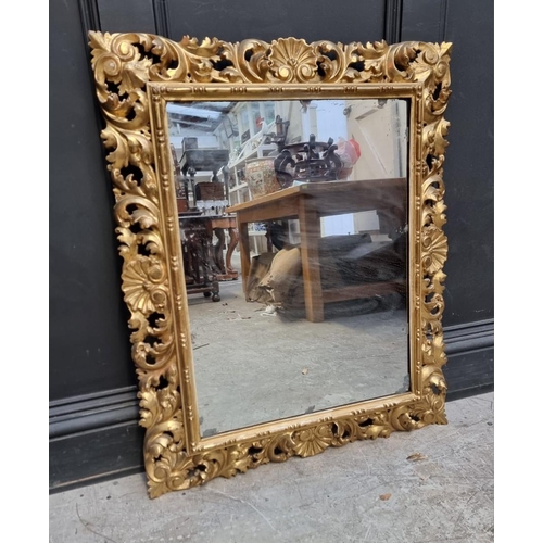 1098 - A Florentine carved giltwood rectangular wall mirror, 90 x 74cm.