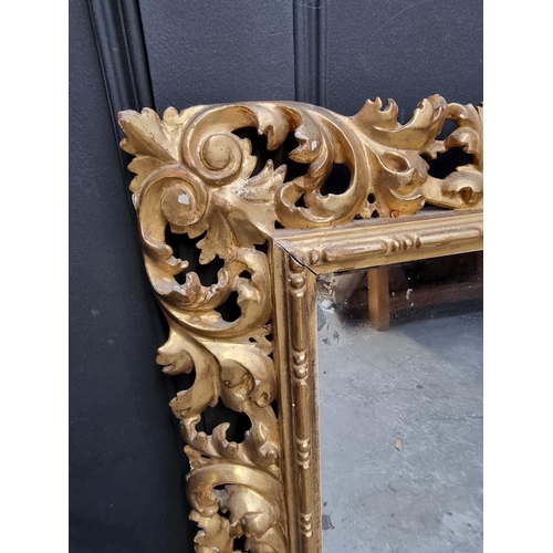 1098 - A Florentine carved giltwood rectangular wall mirror, 90 x 74cm.