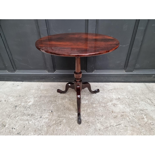 1110 - A mahogany circular tilt-top tripod table, 74cm diameter.