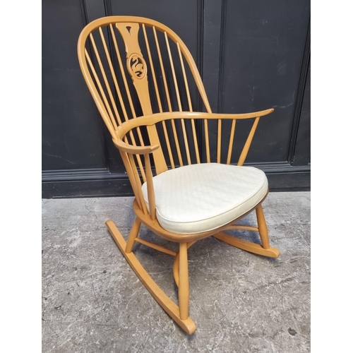 1115 - An Ercol swan back rocking chair.