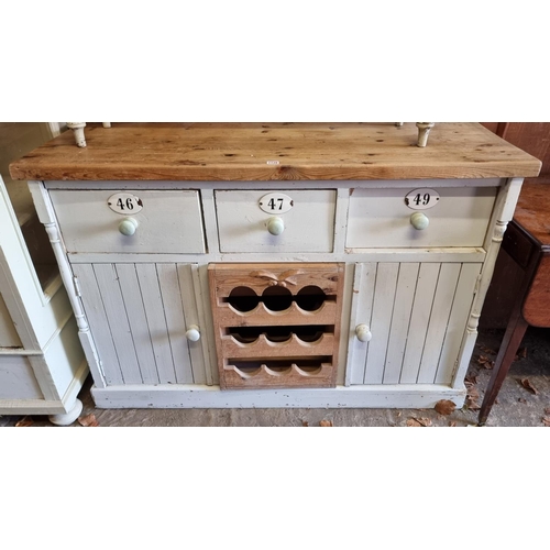 1128 - A painted pine dresser base, 135cm wide.