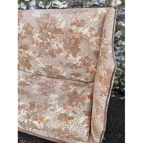 1131 - An antique wingback settee, 123cm wide.