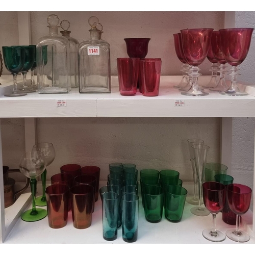 1141 - A collection of antique clear and coloured glass. (two shelves)