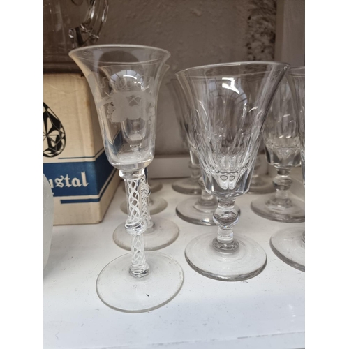 1149 - A mixed group of drinking glasses, to include a set of four reproduction opaque twist examples, 15cm... 