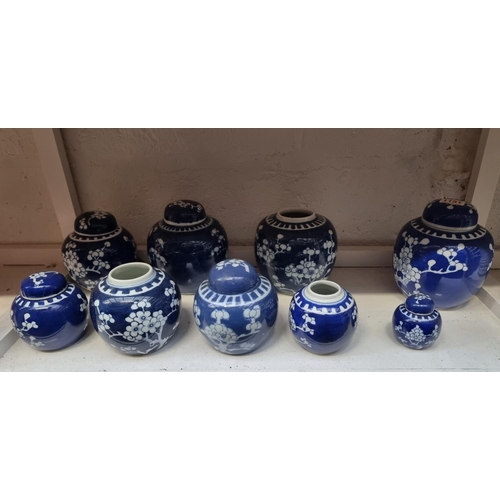 1151 - Nine Chinese blue and white ginger jars and five covers, largest 15cm high. (9)