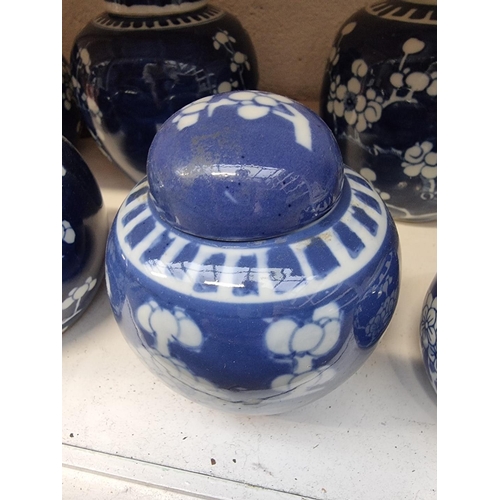 1151 - Nine Chinese blue and white ginger jars and five covers, largest 15cm high. (9)