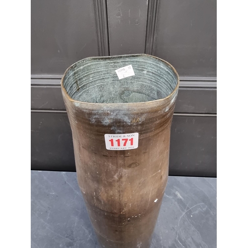 1171 - A large brass shell case, 70cm high.