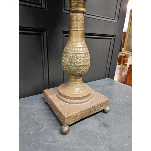 1174 - A Dutch embossed brass pedestal jardiniere, 81cm high.