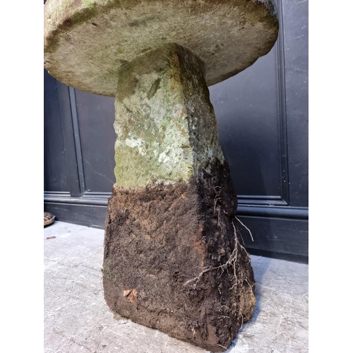 1176 - A near pair of old weathered sandstone staddle stones, 70cm high.