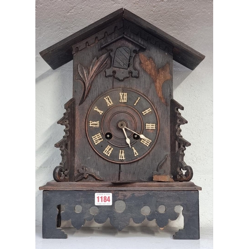 1184 - A old oak cuckoo mantel clock, 42.5cm high, (no pendulum).