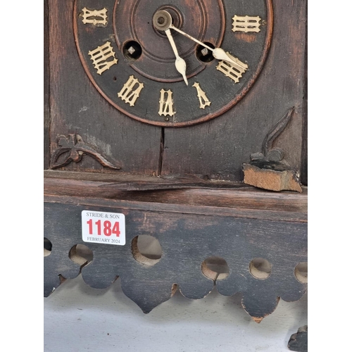 1184 - A old oak cuckoo mantel clock, 42.5cm high, (no pendulum).