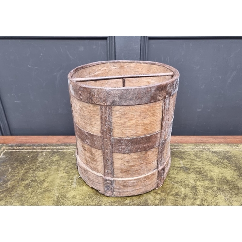 1185 - An old oak and metal bound bucket, possible a grain measure, 33cm high.