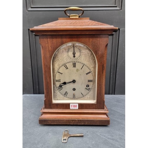 1191 - An early 20th century German mahogany mantel clock, 46cm high, with pendulum.