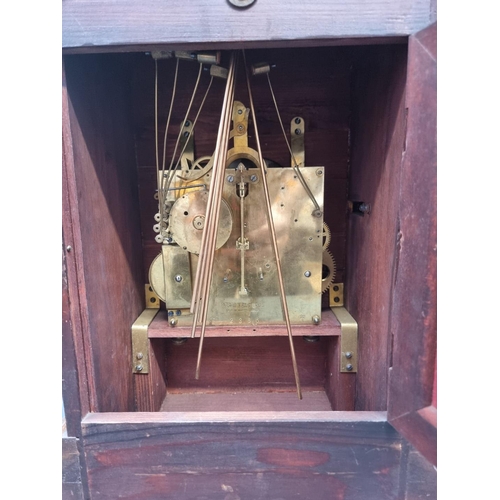 1191 - An early 20th century German mahogany mantel clock, 46cm high, with pendulum.