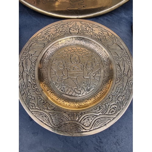 1202 - A small group of Chinese brassware, largest 38.5cm diameter. (4)