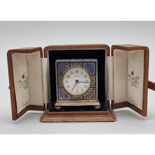 1230 - A Zenith champleve enamel travelling alarm clock, circa 1920s, 6cm high, in simulated crocodile... 