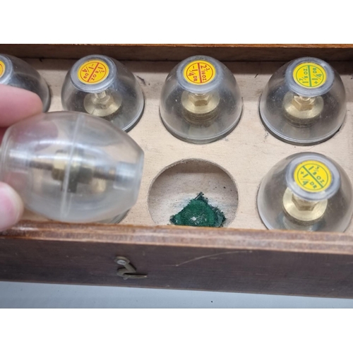 1241 - A vintage cased set of six egg form weight measures. (6)