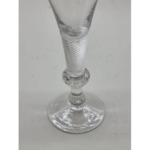 1251 - An antique airtwist wine glass, 16cm high.