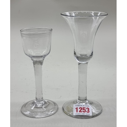 1253 - Two antique plain stem wine glasses, 16.5cm and 14cm high respectively.