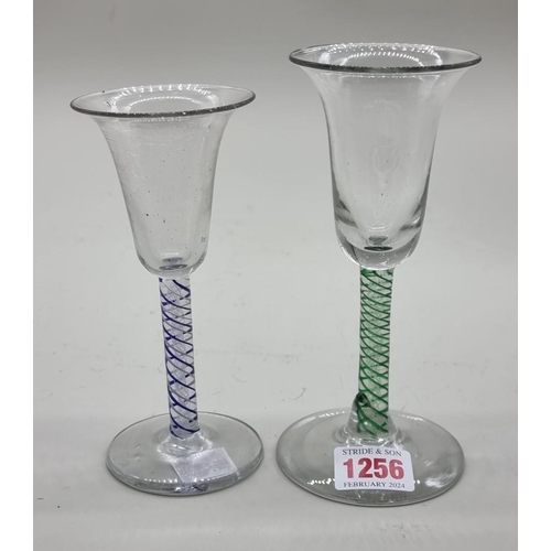 1256 - Two 19th century continental coloured twist wine glasses, 16.5cm and 15cm high respectively. (2)... 