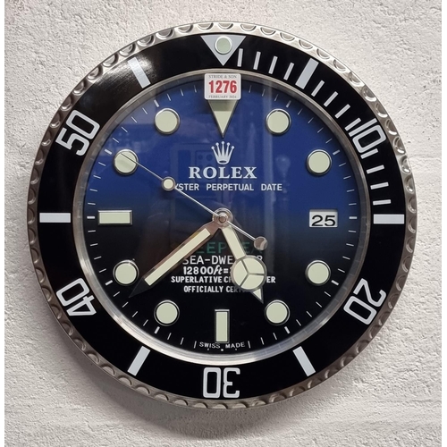 1276 - A Rolex style wall clock, with battery movement, 34cm diameter.