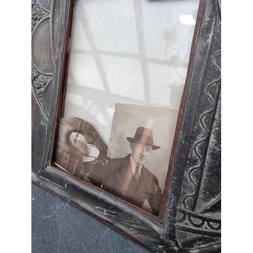 1294 - An Art Nouveau pewter photograph frame, 26.5 x 21cm; together with a novelty easel back propeller fr... 