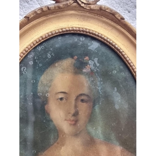 1318 - An antique reverse glass portrait of a lady, 19.5 x 14.5cm oval.