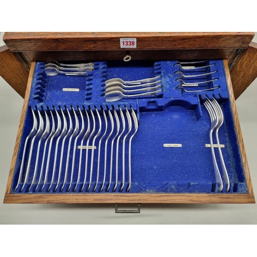 1338 - An early 20th century oak canteen of electroplated cutlery, for twelve, 48cm wide, (incomplete).... 