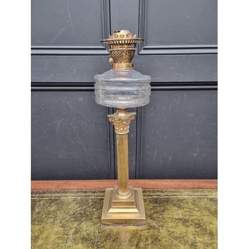 1343 - A brass Corinthian column oil lamp, total height 58cm.