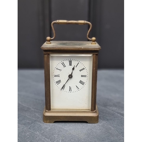 1345 - An old brass carriage timepiece, height including handle 13.5cm.