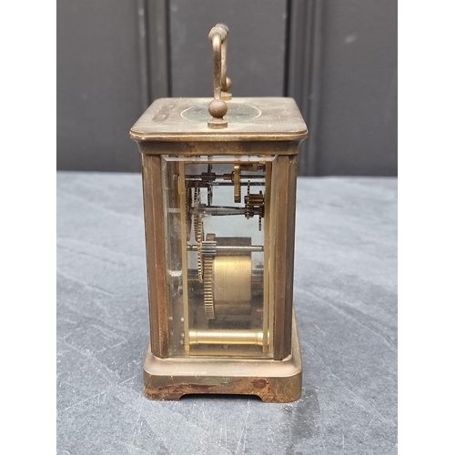 1345 - An old brass carriage timepiece, height including handle 13.5cm.