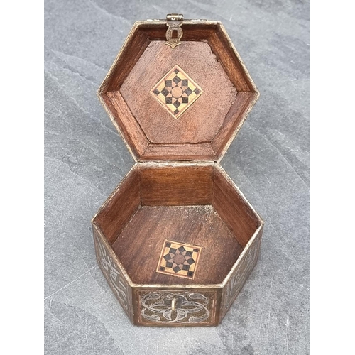 1351 - An Islamic Cairoware hexagonal casket, with script to hinged top, 10cm wide.