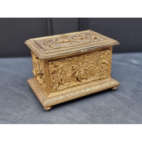 1365 - An antique French gilt metal musical jewellery box, relief decorated with figures, stamped 'L Oudry,... 