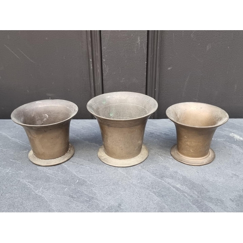 1394 - Three 18th century brass mortars, largest 9.8cm high. (3)