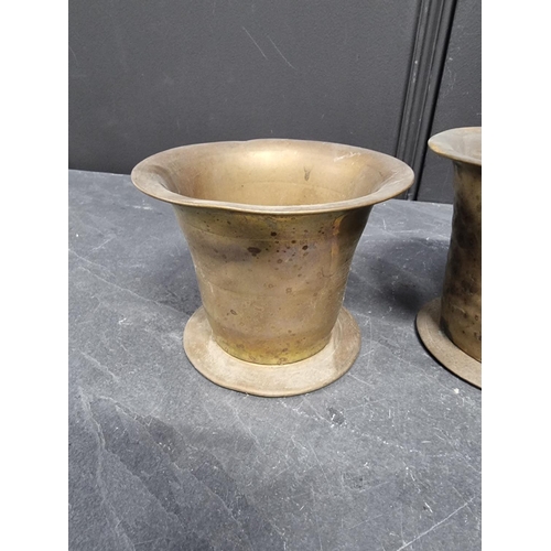 1396 - Three 18th/19th brass mortars, largest 10.6cm high. (3)