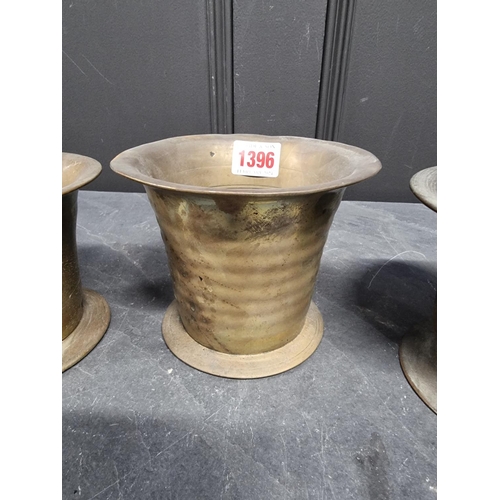 1396 - Three 18th/19th brass mortars, largest 10.6cm high. (3)