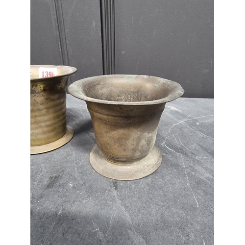 1396 - Three 18th/19th brass mortars, largest 10.6cm high. (3)