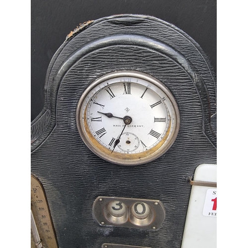 1401 - A late 19th century leather desk calendar, incorporating a clock and thermometer, 21.5cm wide.... 