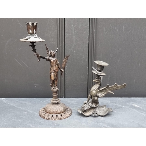 1409 - A bronze figural candlestick, 32cm high, together with another metal griffin candlestick, 19cm high.... 