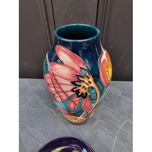 1419 - A Moorcroft vase, tube lined with a dragonfly and flowers, 21cm high; together with a similar 'Celti... 